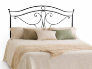 Cabecero de forja Viena negro con diseño ornamental y líneas curvas en dormitorio elegante